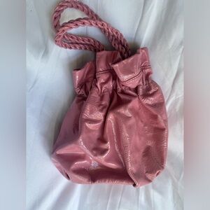 Bubblegum-pink patent-leather bag by Staud.